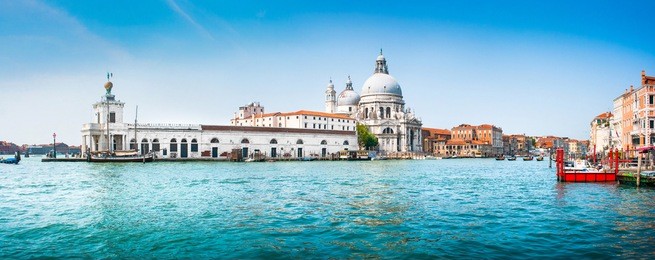 panoramic view of famous canal grande with basilica di santa maria della salute in the background, venice, italy