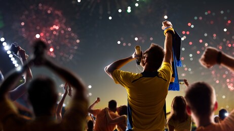 fans celebrate in stadium arena night fireworks high quality photo