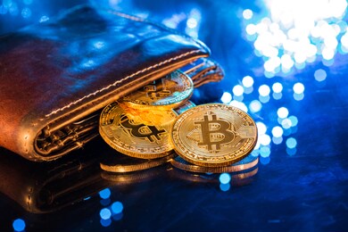 bitcoin gold coins with wallet, close-up. virtual cryptocurrency concept.