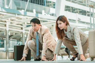 smart asian businessman and businesswoman standing in start position runner, business competition concept.