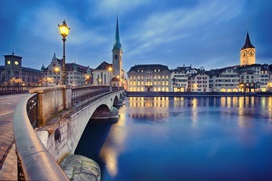 view on fraumunster church and church of st. peter at night, zurich, switzerland
