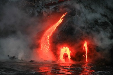 lava flowing into ocean in the dark, big island, hawaii 