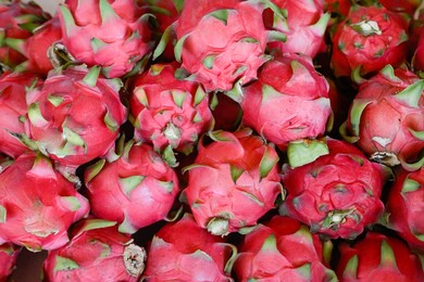 pitayas or pitahayas in asian market. group of exotic tropical fruits

