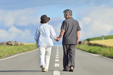 japanese senior couple walking on the road, holding hand.