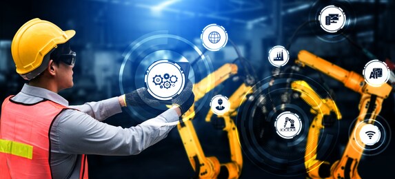 engineering technology and industry 4.0 smart factory concept with icon graphic showing automation system by using robots and automated machinery controlled via internet network .