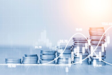 stock market investment and business profit concept, double exposures of increasing coins stacking with technical line and candle chart.