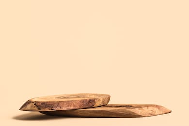 wood podium on beige background for cosmetic product mockup.