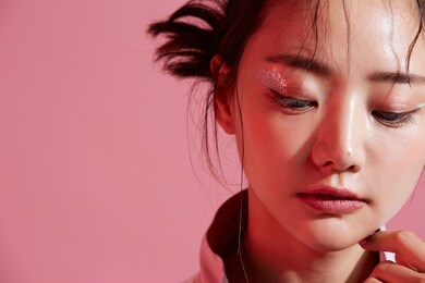 young asian woman with glitter make-up wearing sporty fashion