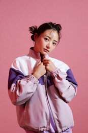 young asian woman with glitter make-up wearing sporty fashion