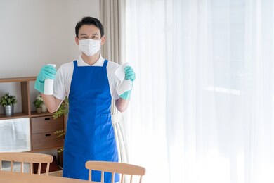 asian man wearing an apron