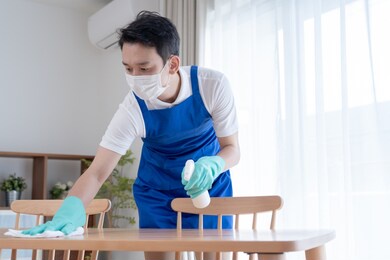 asian man wearing an apron