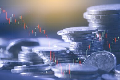 double exposure of finance graph , stationary and rows of coins for goal office , finance and business concept background and forex trading graph with economy trends business or finance background.