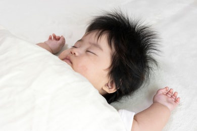 baby's face sleeping on a futon, 0 years old, 4 months old, girl