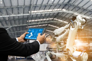 manager engineer check control automation robotic arms, industrial robots, factory automation machines