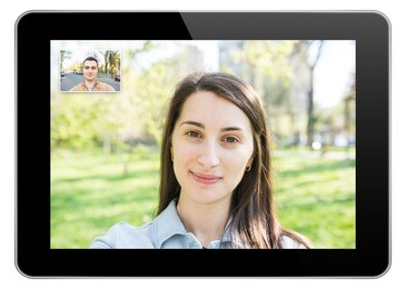 pretty young girl video call with young man on modern tablet similar to ipad
