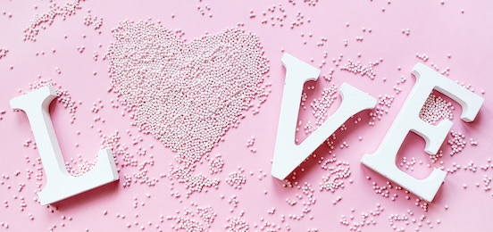 banner.the word love in white letters on a trendy pink background. happy valentine's day, mother's day, march 8, world women's day holiday card concept. flat lay. 