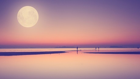 full moon over blue sea and sky ,long exposure technique with vintage filter
