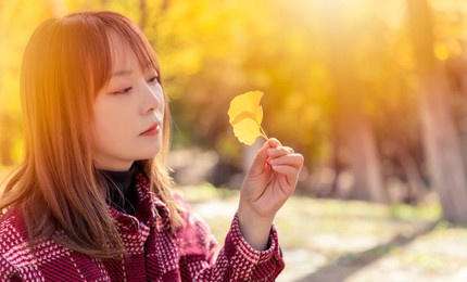 beautiful asian women in the park in autumn