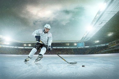 ice hockey player on the ice. open stadium - winter classic game.