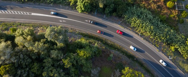 traffic on a spanish road with cars driving seen from above aerial view	