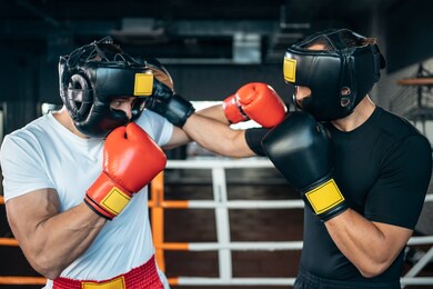 two muscle boxers sport man training and fighting on boxing ring at gym