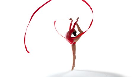 rhythmic gymnast isolated on white.