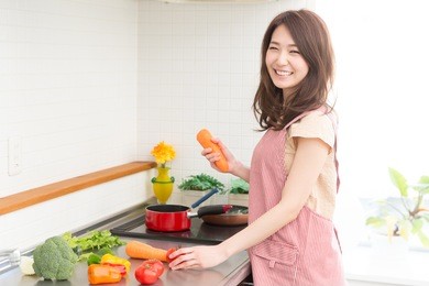 young attractive asian woman who cooks
