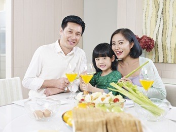 asian family having meal at home
