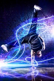 young strong man break dance. with light effects.