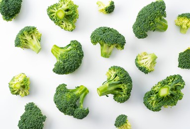 cut broccoli placed on a white background. view from directly above. broccoli background