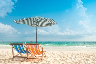 two chairs and umbrella at the beach