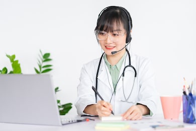 asian female doctors are examining patients remotely, doctors can now use video call software on computers to check online for customers.
