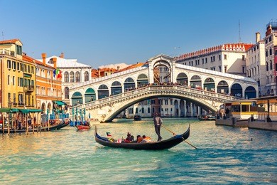 gondola near rialto bridge in venice, italy
