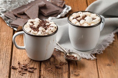 freshly hot chocolate with marshmallows in two enamel tin mugs