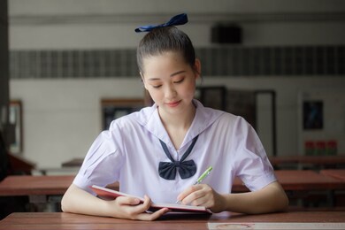 asia thai junior high school student uniform beautiful girl read a book
