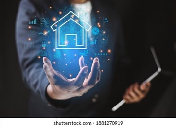 insurance concept businessman on hand shows a house icon that transact with corporate sector companies for insurance eligible customers

