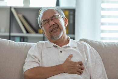 asian elderly senior man heart attack so pain on chest and illness