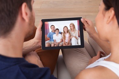high angle view of young couple using digital tablet together at home