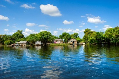 floating house and  houseboat on the tonle sap lake, between battambang and siem reap. cambodia.