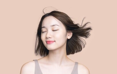 beauty concept of a young asian woman. hair care. cosmetics.