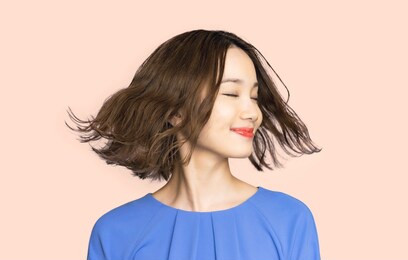 beauty concept of a young asian woman. hair care. cosmetics.