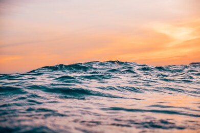 waves on the beach in the tropics at sunset