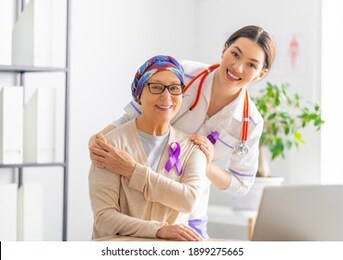 february 4 world cancer day. female patient listening to doctor in medical office. raising knowledge on people living with tumor illness.
