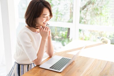 beautiful young asian woman using laptop