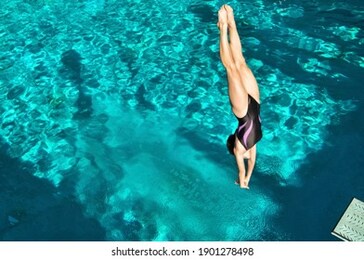 portrait of woman diving in pool