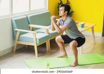 asian man doing exercise at home
