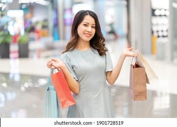 the young girl was happily showing off what she just bought
