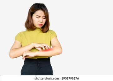 asian woman scratching her itchy arm cause of dry skin, food and drugs allergies ,dermatitis , skin problem concept 