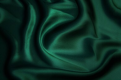 texture, background, pattern. texture of green silk fabric. beautiful emerald green soft silk fabric.