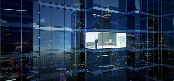 businessman using mobile phone to talk business in office. view from the outside 3d rendering commercial skyscraper.